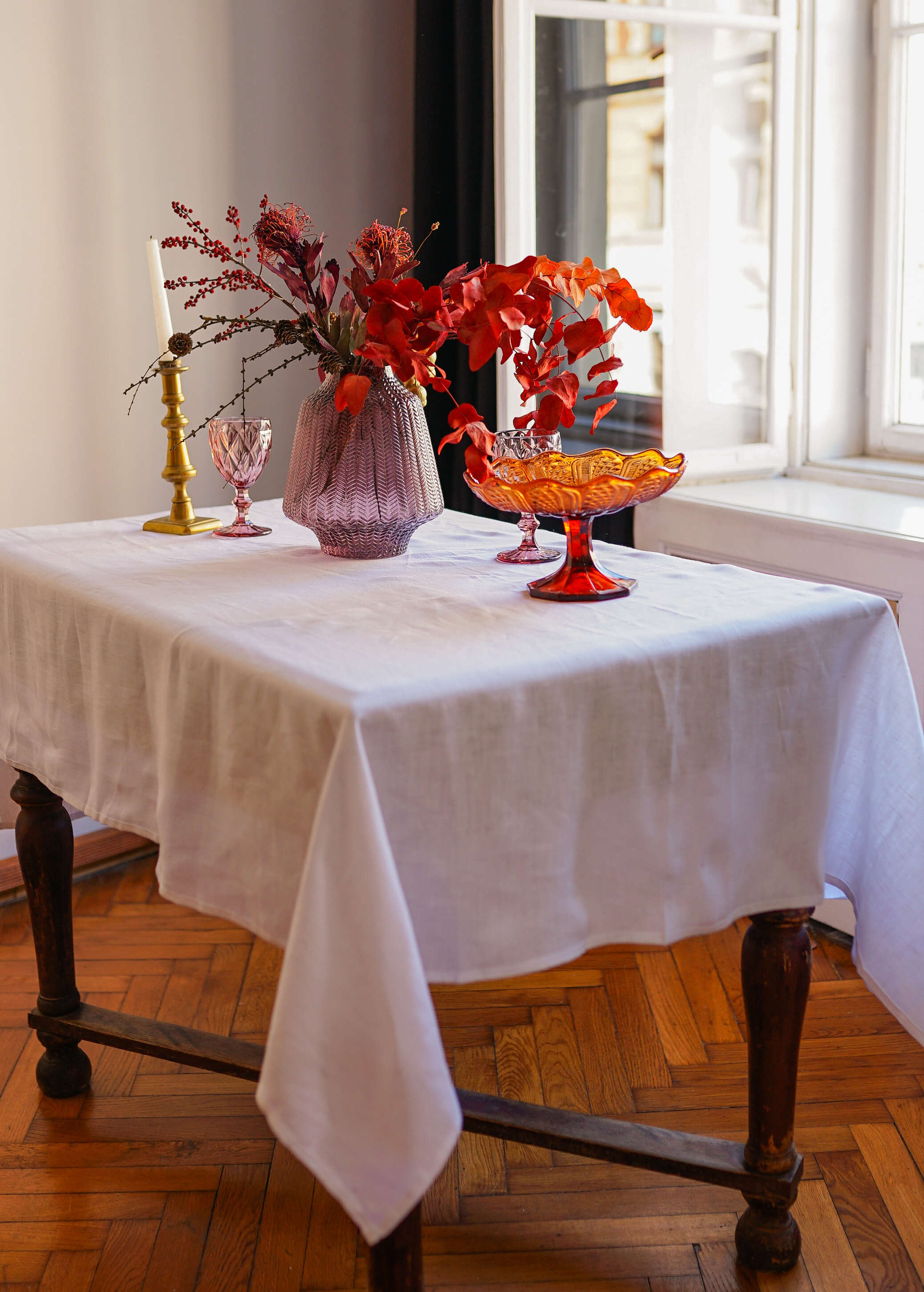 a table with a vase of flowers on it