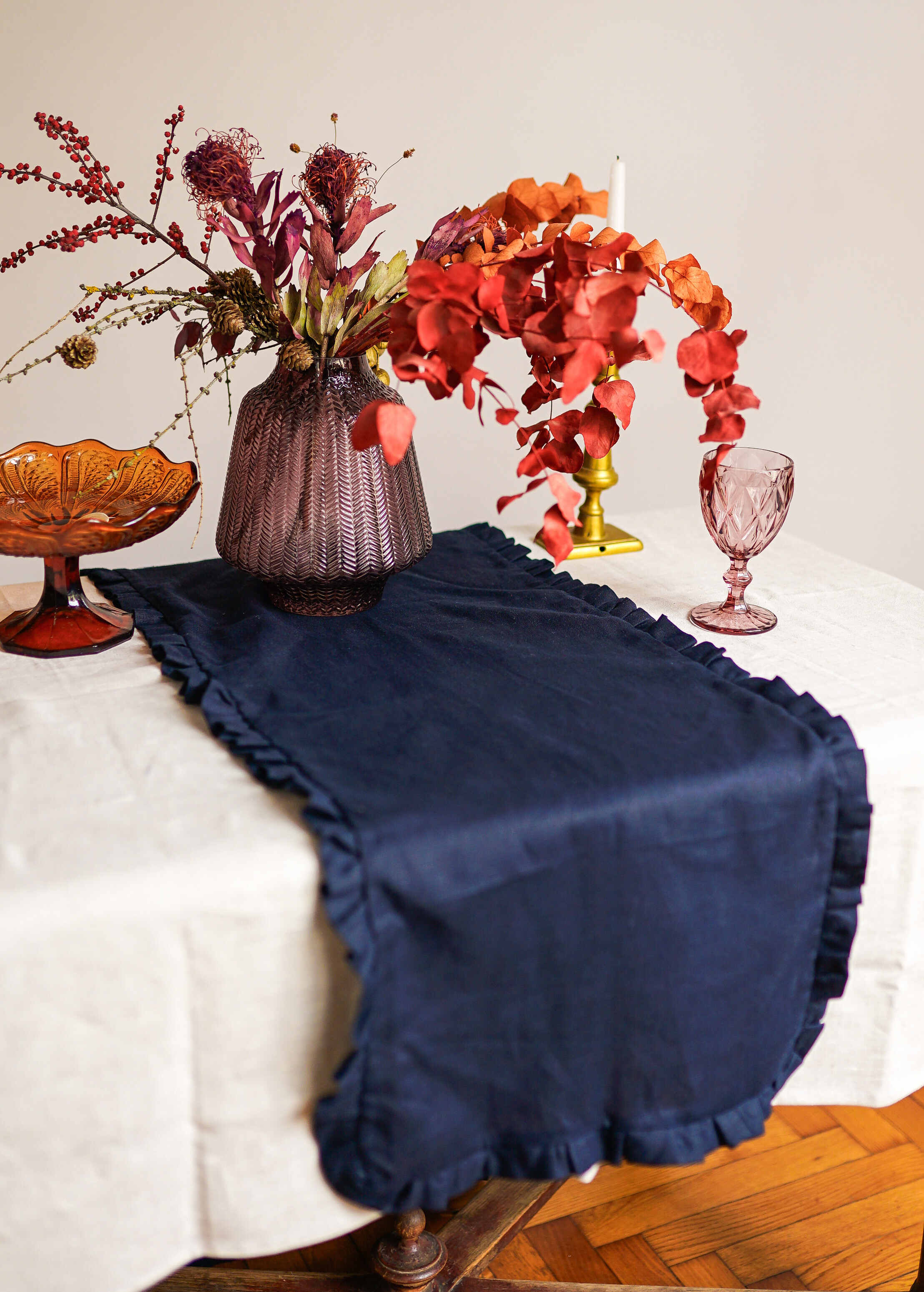 a table topped with a vase filled with flowers