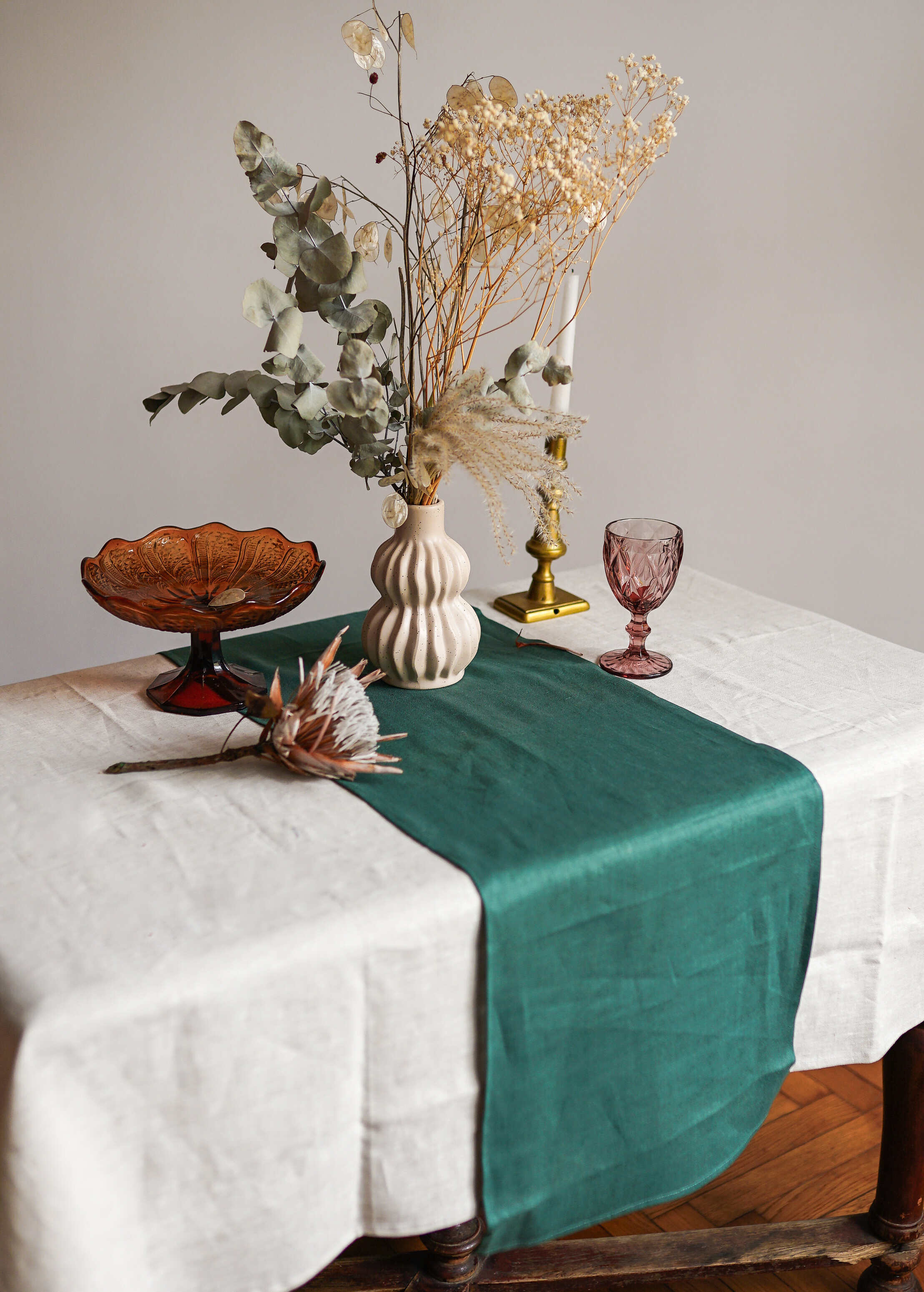 a table topped with a green table cloth